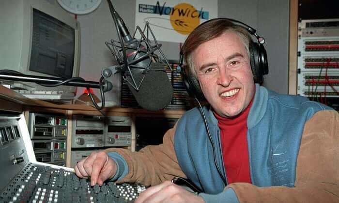 A still from the TV show, Alan Partridge, where Alan Partridge is in his radio studio