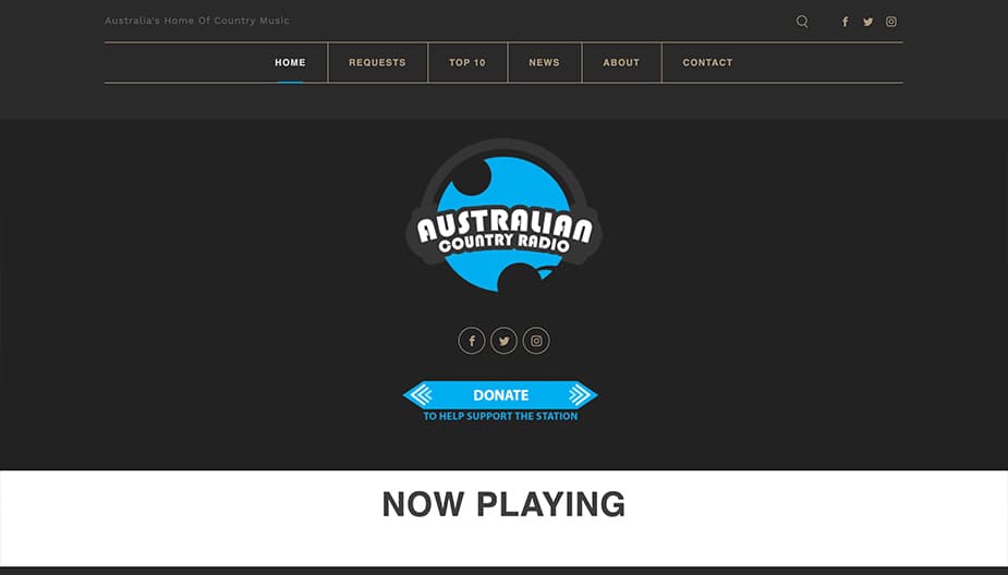 This is a screenshot of Australian Country Radio, a black homepage with their lightblue logo in the middle of the page. The logo is a circle with smaller circles around it, and a Now Playing banner at the bottom.