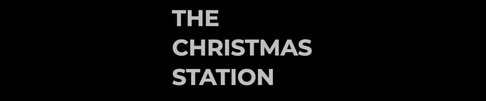 Image shows the logo for The Christmas Station featuring a black background and the station name in white font.