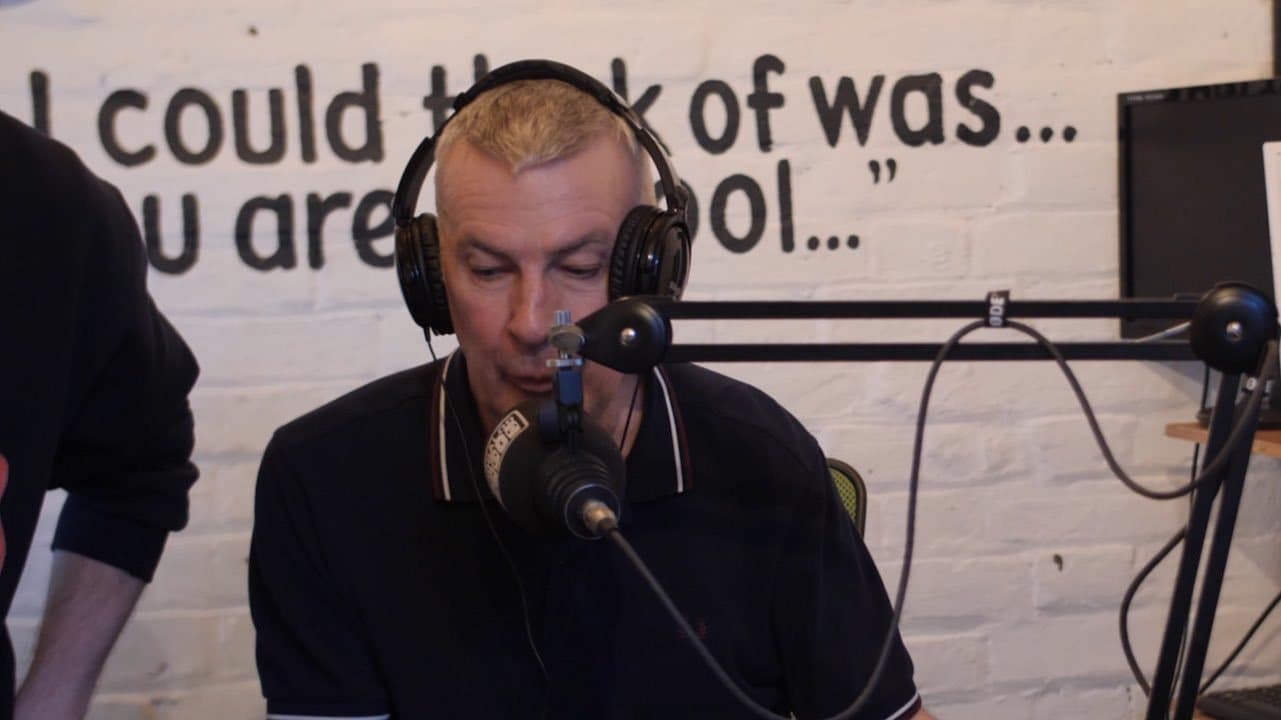 Image shows a Boogaloo Radio presenter, presenting his show.