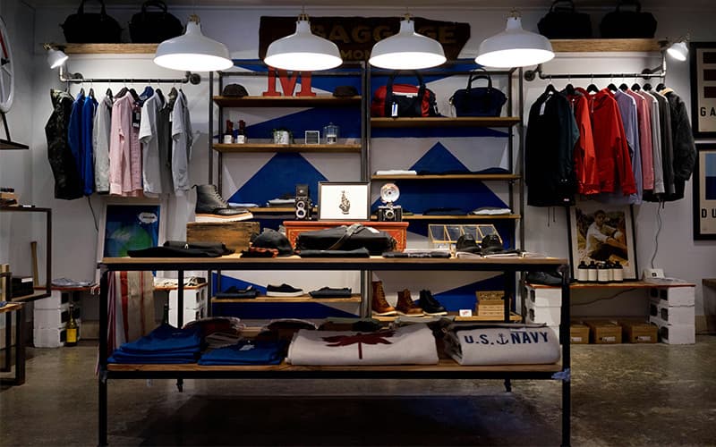 Image shows the inside of a clothing and lifestyle store.