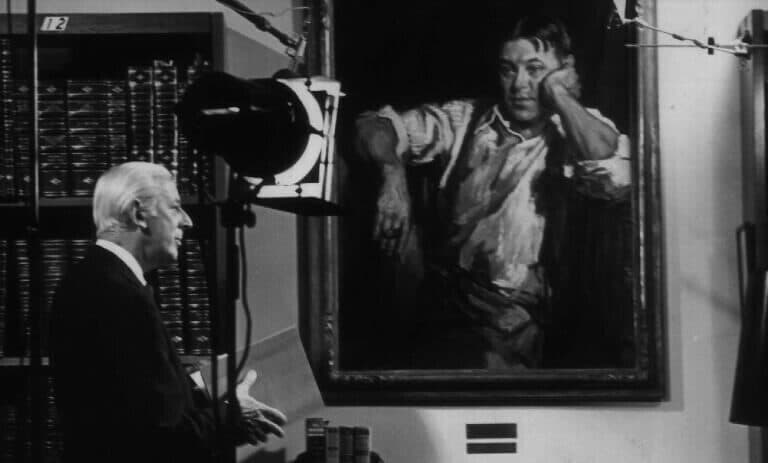 A black and white photo of Alistair Cooke.