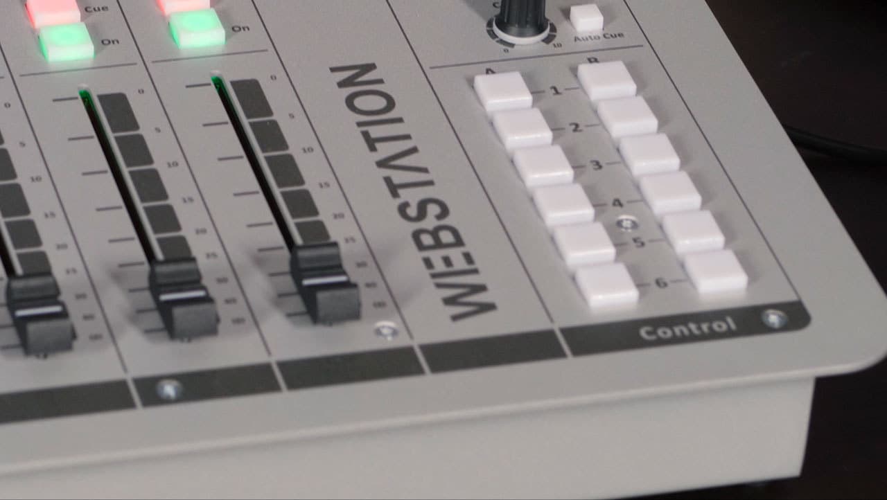 Image is a close-up of the cart buttons on the D&R WEBSTATION USB Mixer.