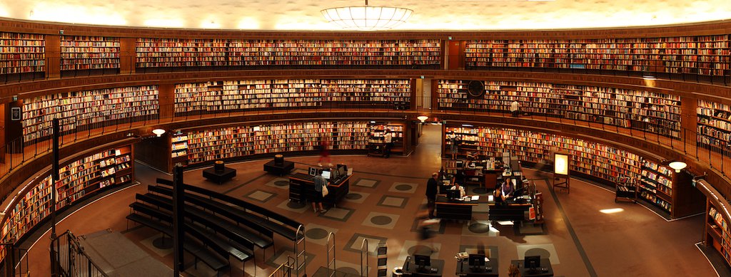This is the same image as the cover image for this article. This is an image of a huge circular library, seemingly a massive university or college one, with plenty of books visible in warm light, and a mahogany colour scheme.