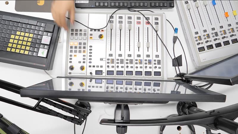 Image shows the Fuse FM mixing desks and computer, taken from above.