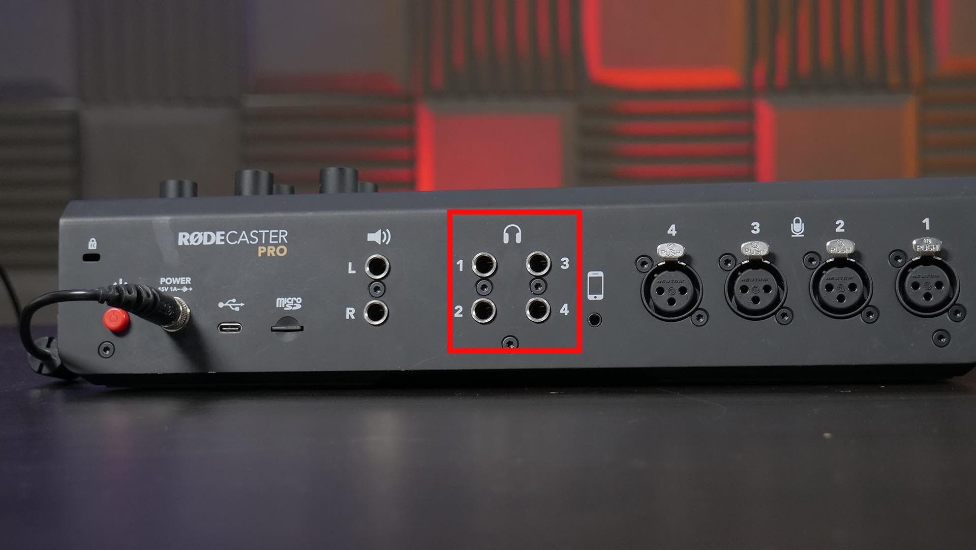 Image shows the back of the Rodecaster Pro, and the headphone inputs are highlighted with a red square.