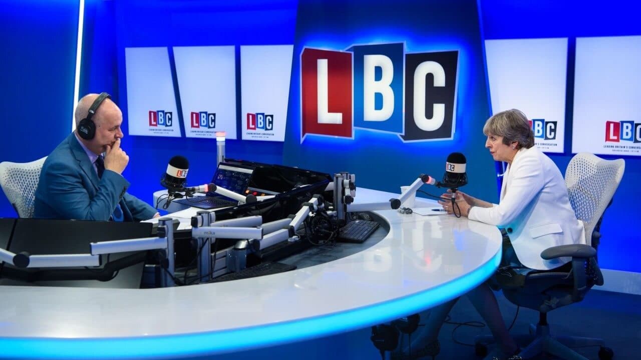 Image shows the LBC radio studio where the radio host is interview the British politician, Theresa May.