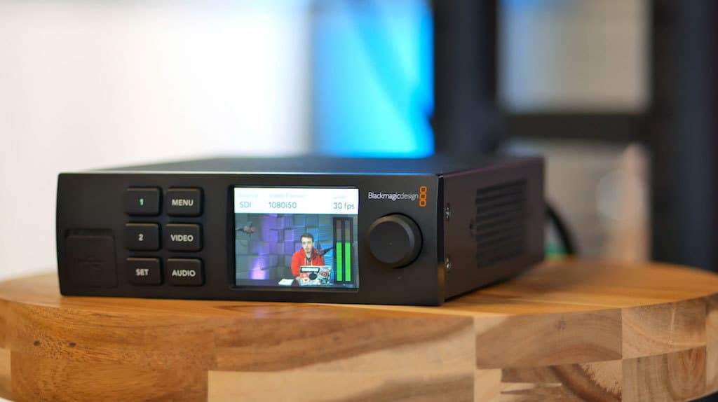 Image shows the Blackmagic Web Presenter on a table.