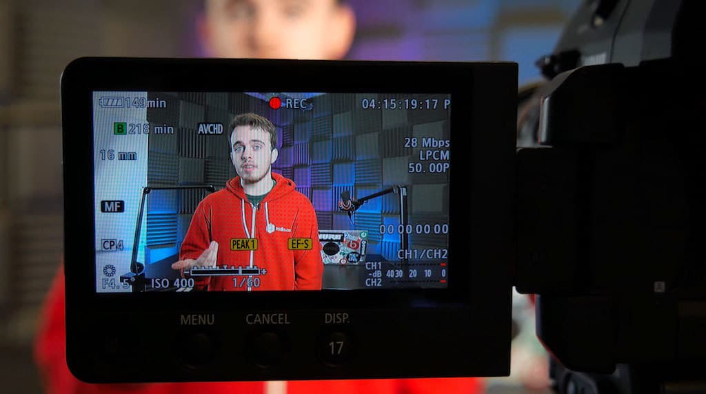 Image shows a camera screen, with a man presenting their livestream.