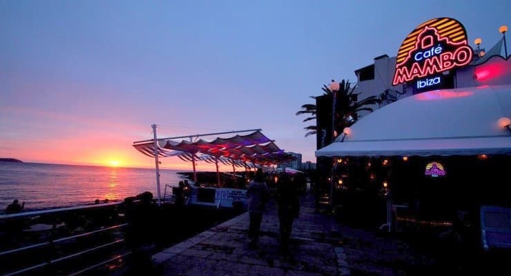 Image shows Cafe Mambo and the sea at sunset.