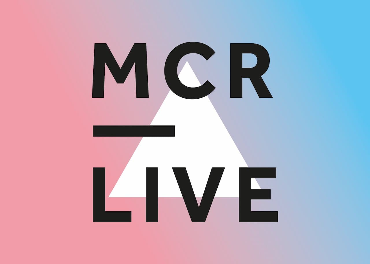 This is a pink and blue backdrop with the words MCR LIVE in black and a white triangle over it.