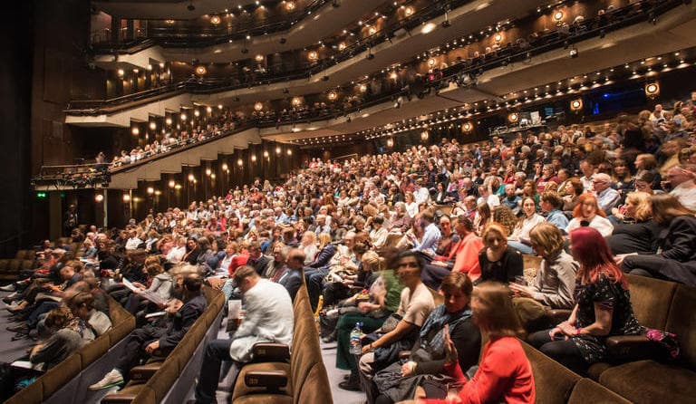 Image shows the audience at Barbican's performing arts theatre