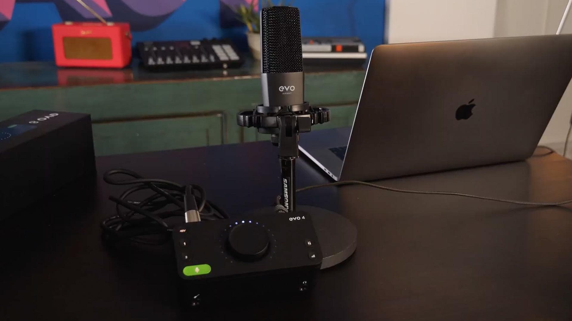 Image shows the Audient EVO bundle and a Macbook on a table.