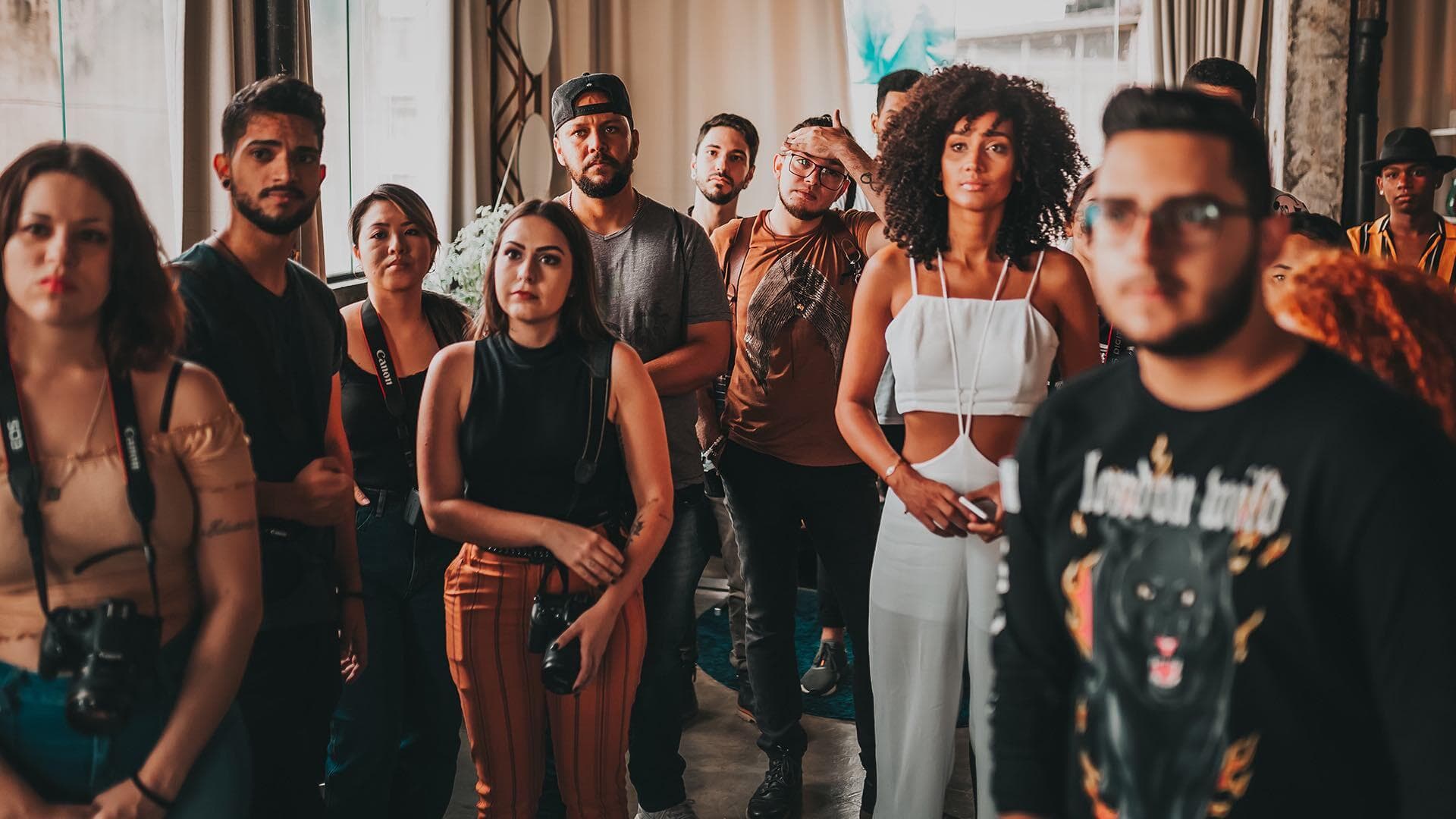 A group of people listening to a leader who is out of the shot.