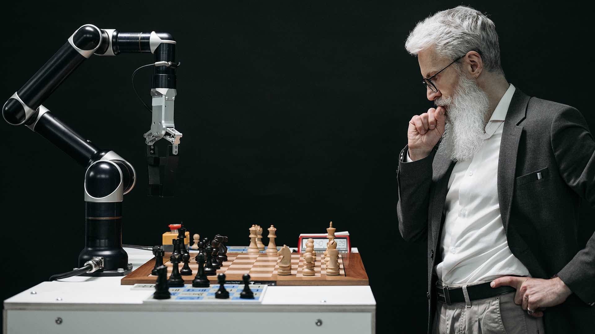 A man playing a machine in a chess match.