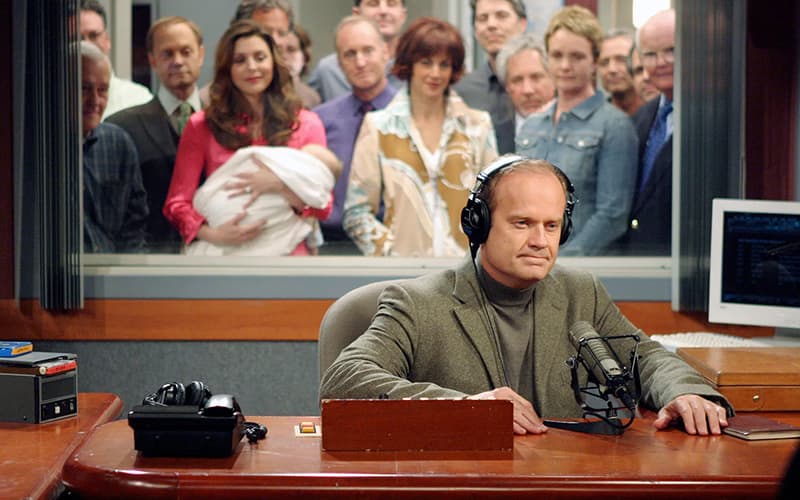 Image shows a still of the character Frasier Crane signing off on his last ever radio show.