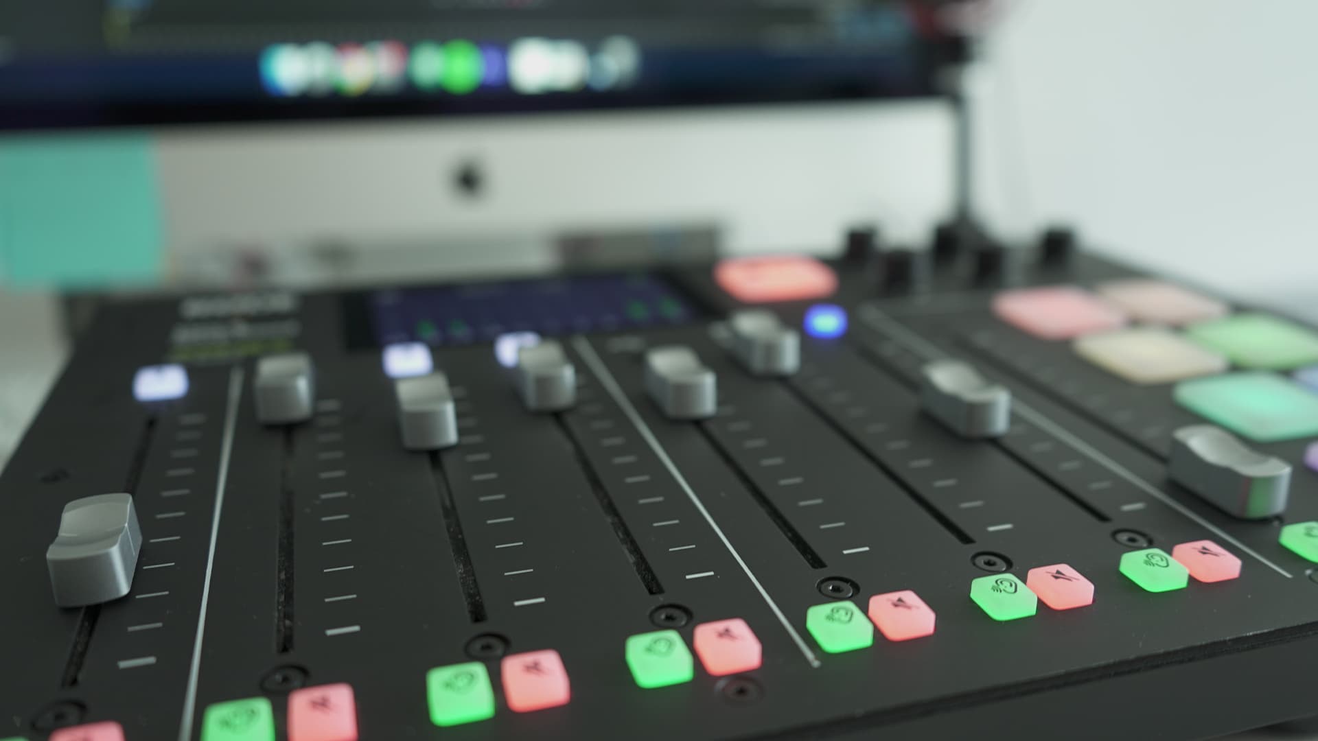Image shows a close up of the faders on the Rodecaster Pro.