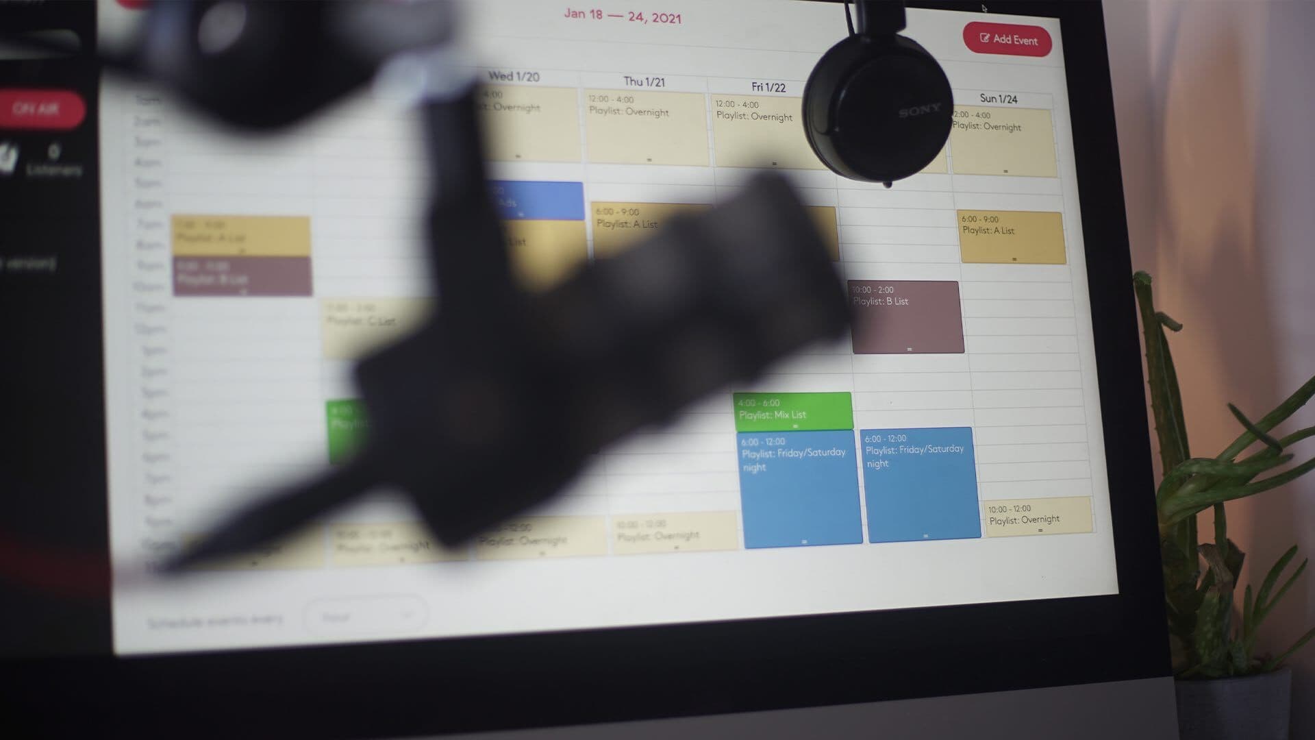 Image shows a radio programme schedule on a computer in a radio studio