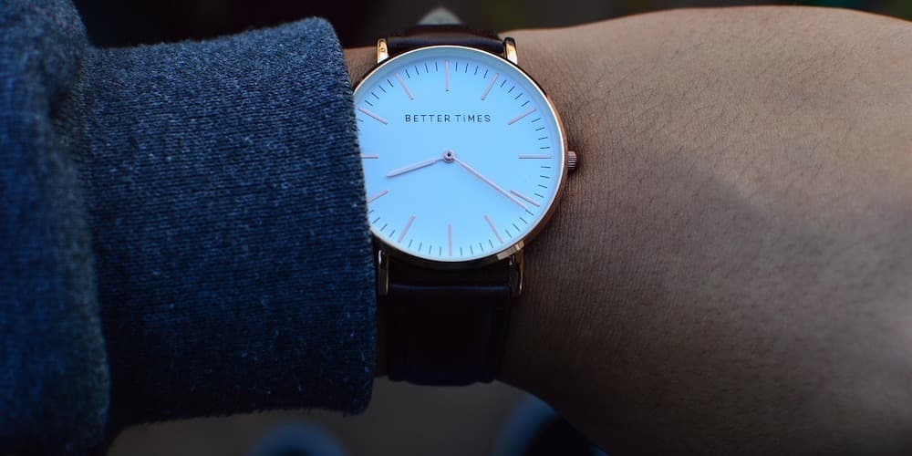 Image shows a close-up of a watch on a wrist.