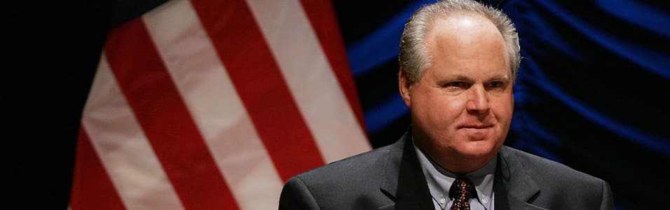 Image shows a head and shoulders shot of Rush Limbaugh, with an American flag behind him.