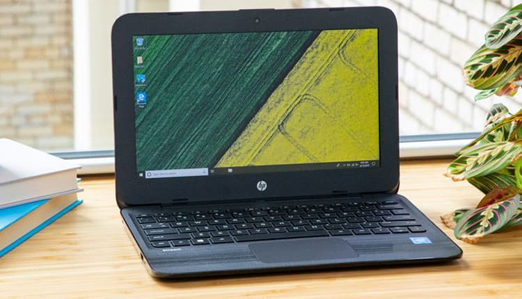 Image shows a HP-Stream 11-ak0001na Laptop, open on a desk.