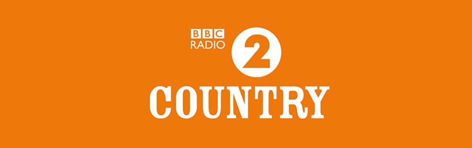 This is an orange background. In white text are the words BBC Radio 2 Country