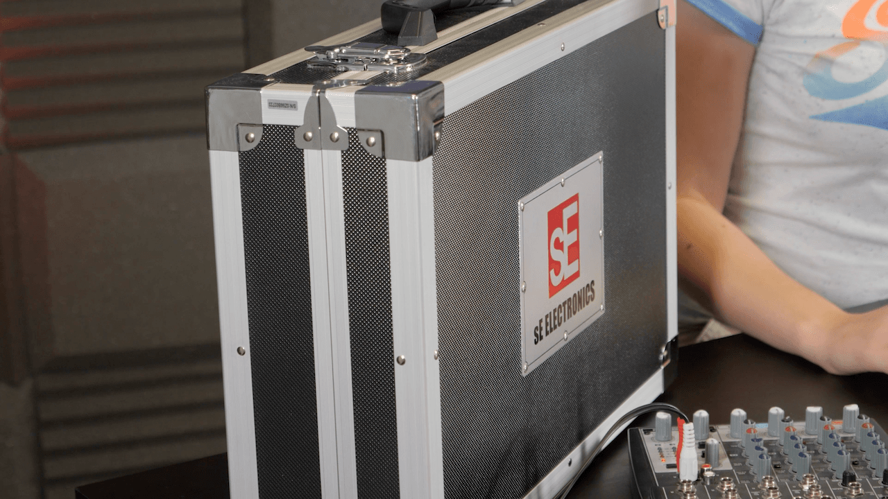 Image shows a sE Electronics Z56000A II hard case on a desk next to a mixer.