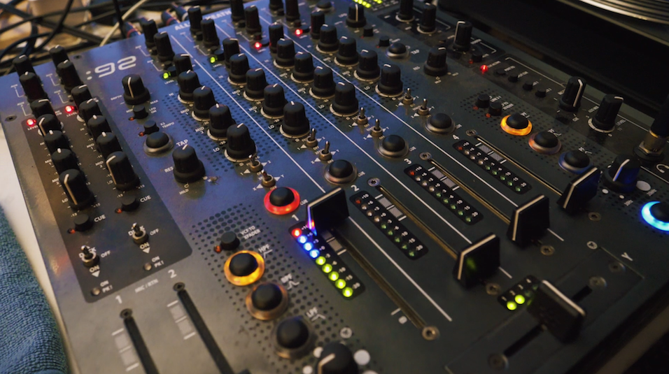 This is a mixer, the Allen & Heath Xone:92 mixer, with different knobs and dials in black, red, orange and other colours.