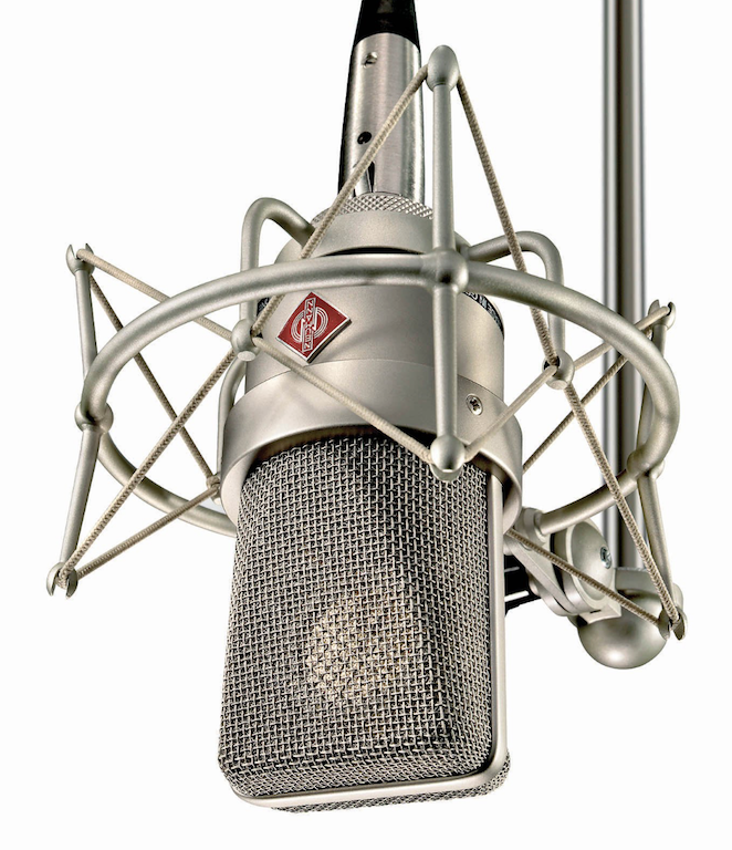 This is a stock image of the Neumann TLM 103, a silver microphone with a red diamond logo in the centre