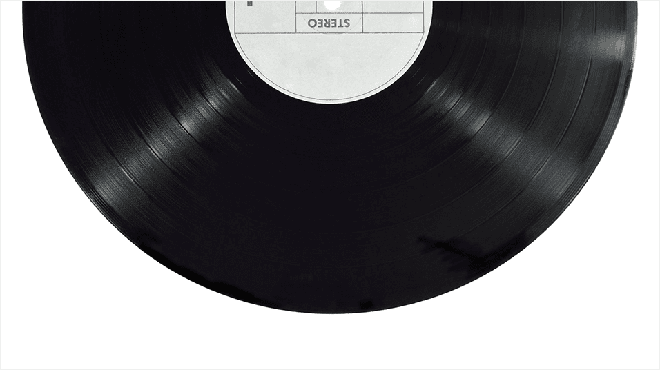Half of a plain black vinyl record appears as the header image, placed on a white background.