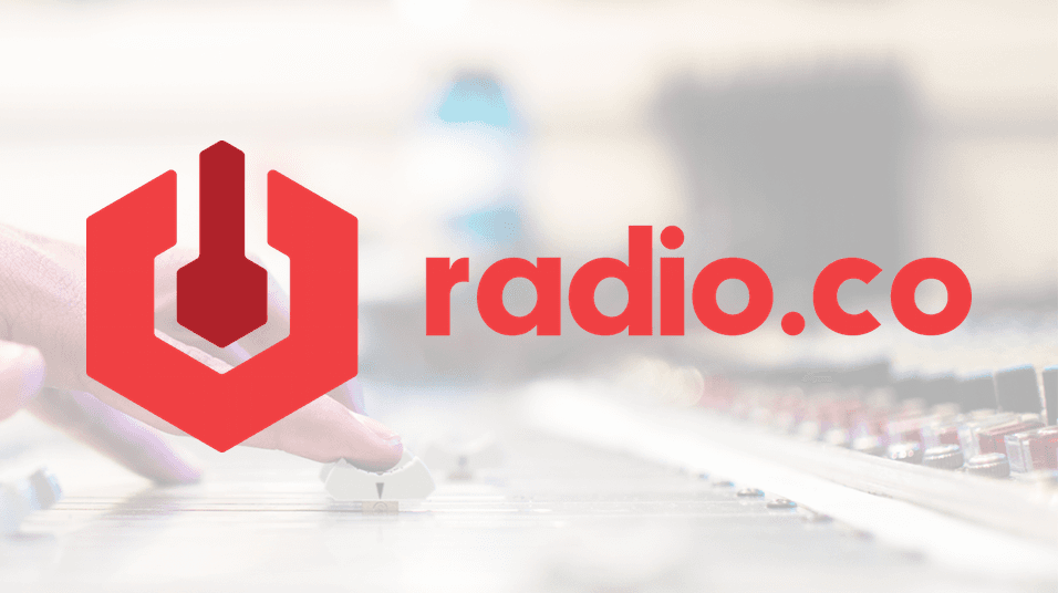 This is an image of the Radioco Logo, a red octagon with a signal in the centre, and the name radio.co next to it. It is overlayed over a blurred background of fingers on a mixing desk.
