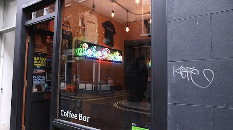 Image shows the glass frontage of the Soho Radio studio.
