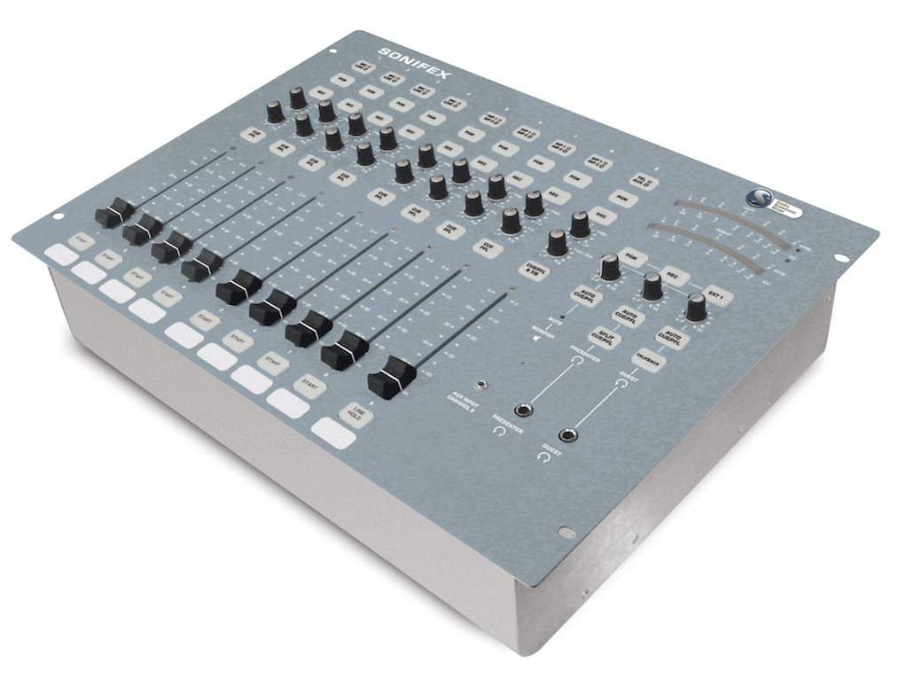 Image shows the grey Sonifex S0 mixing desk, a box style with several faders at the bottom, 2 meters on the right hand side, and various control knobs and buttons.