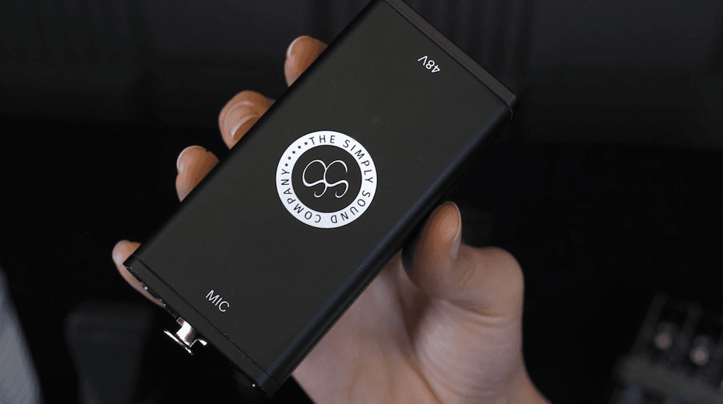 Image shows a hand holding the Simply Sound SS-1 preamp.